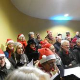 Carolsinging met T2muziek en Heelsums Gelegenheidskoor in muziektent